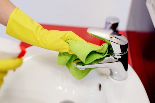 Carpet cleaning team using safe working practices in a property